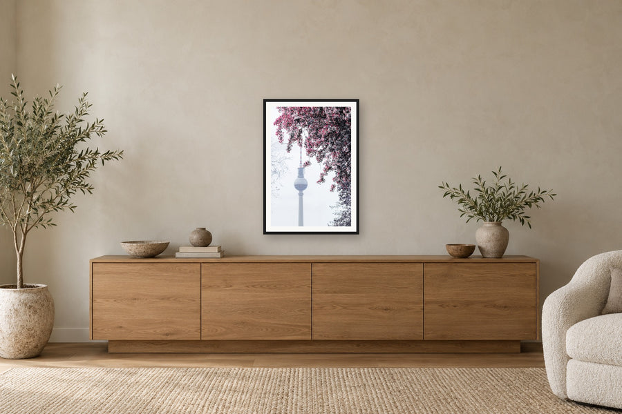 A framed print by Ahmad Photographs above a wooden sideboard