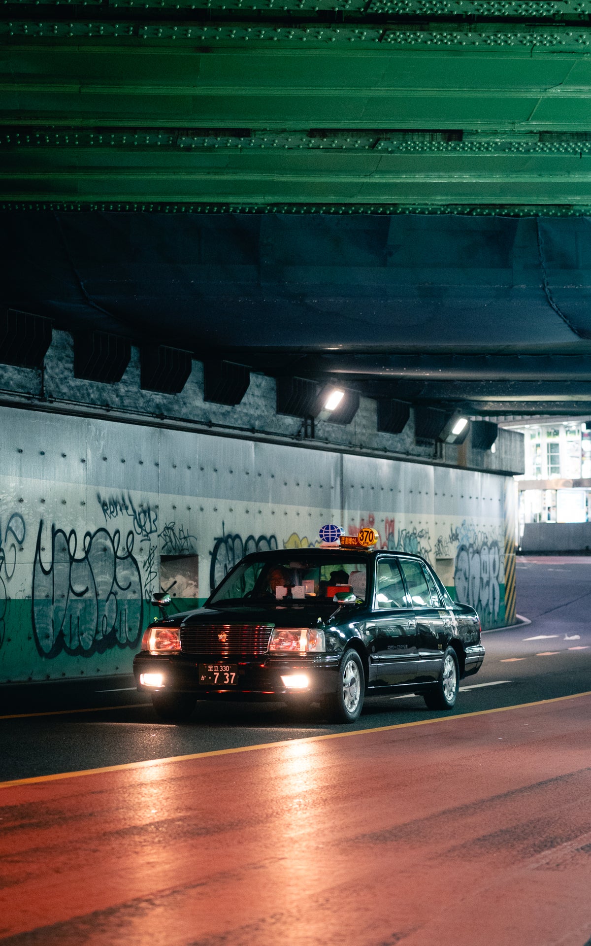 Taxi driving through an underpass
